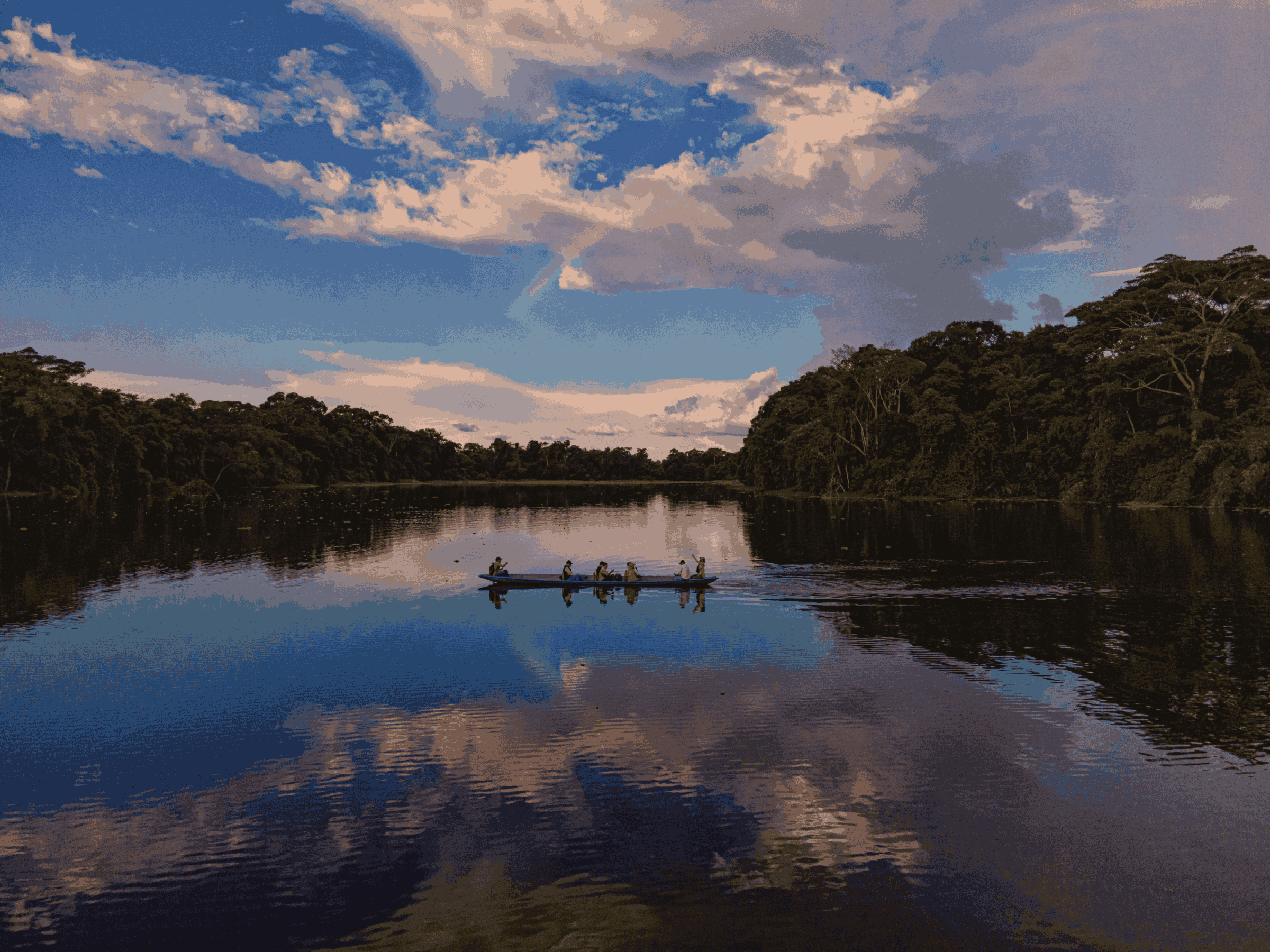 people in a canoe on a wide river