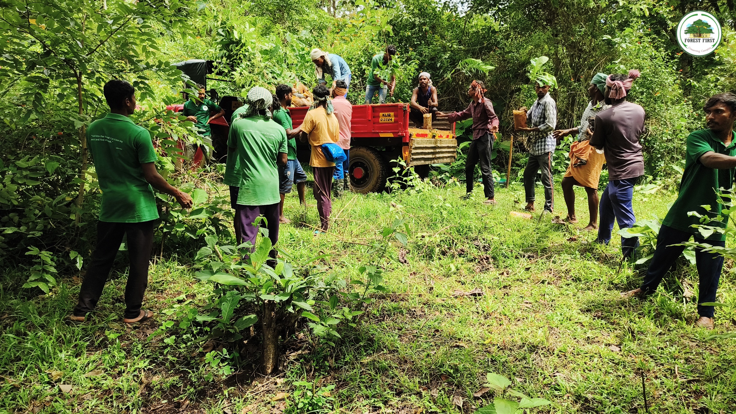“Restorers” Unloading Native Saplings. Credit: Forest First Samithi